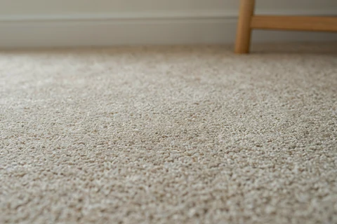 Close-up of woven carpet fibres in natural daylight